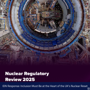 Overhead view of a large circular nuclear construction site with scaffolding, cranes, and equipment arranged around the central structure. The lower portion of the image has a dark purple overlay with white text reading ‘Nuclear Regulatory Review 2025’. Beneath this, a blue banner includes the text: ‘IDN Response: Inclusion Must Be at the Heart of the UK’s Nuclear Reset’.